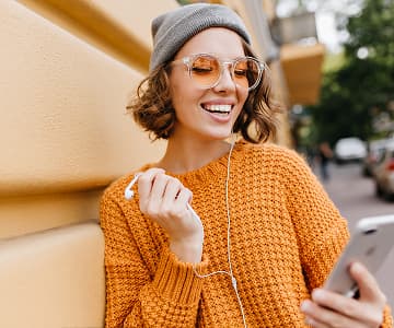 Smiling girl with a smartphone